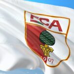 Kiel’s Impressive Victory Against Augsburg Pushes Them Closer to Relegation Playoffs